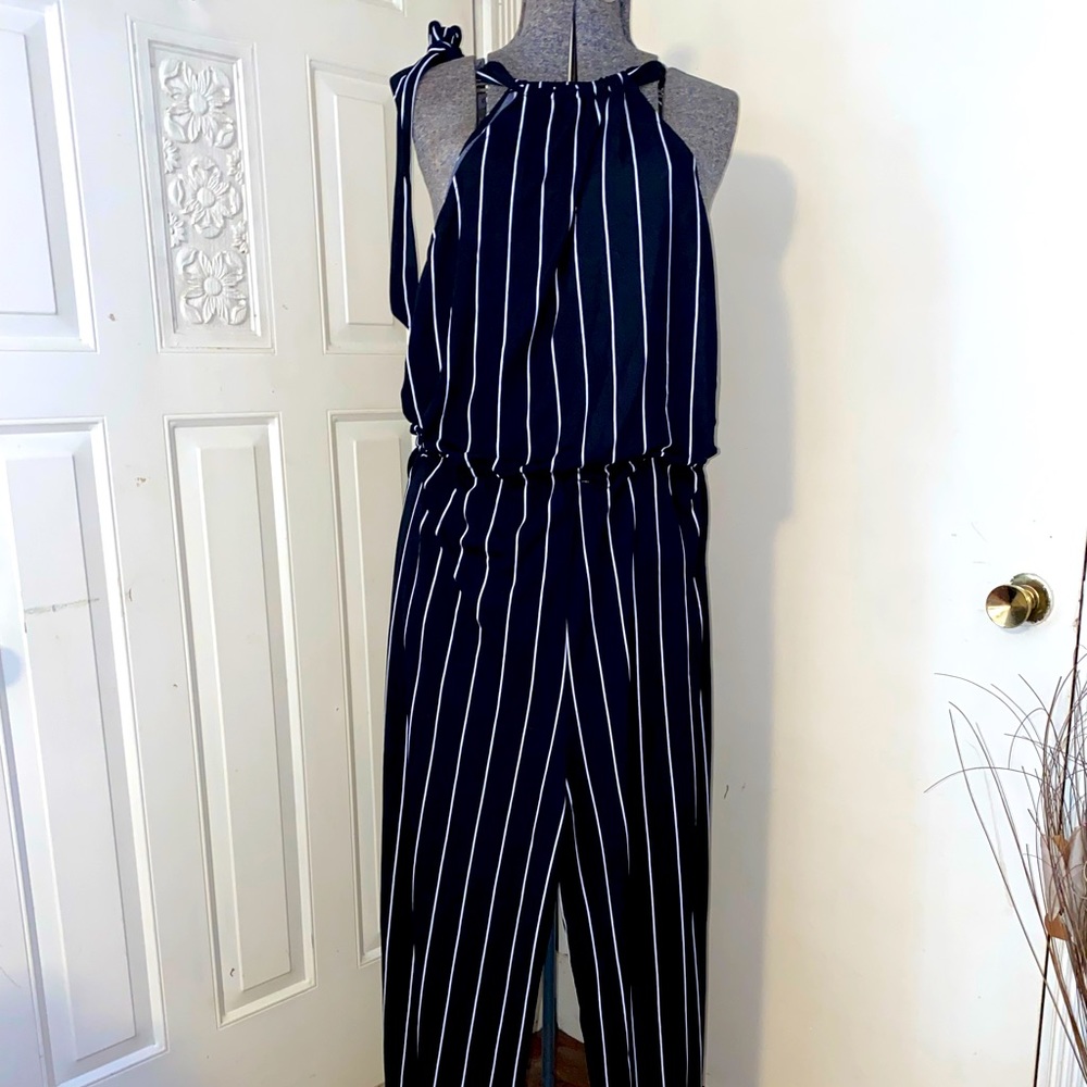 Beautiful Ralph Lauren jump suit. Cinched waist band, adjustable neck tie.